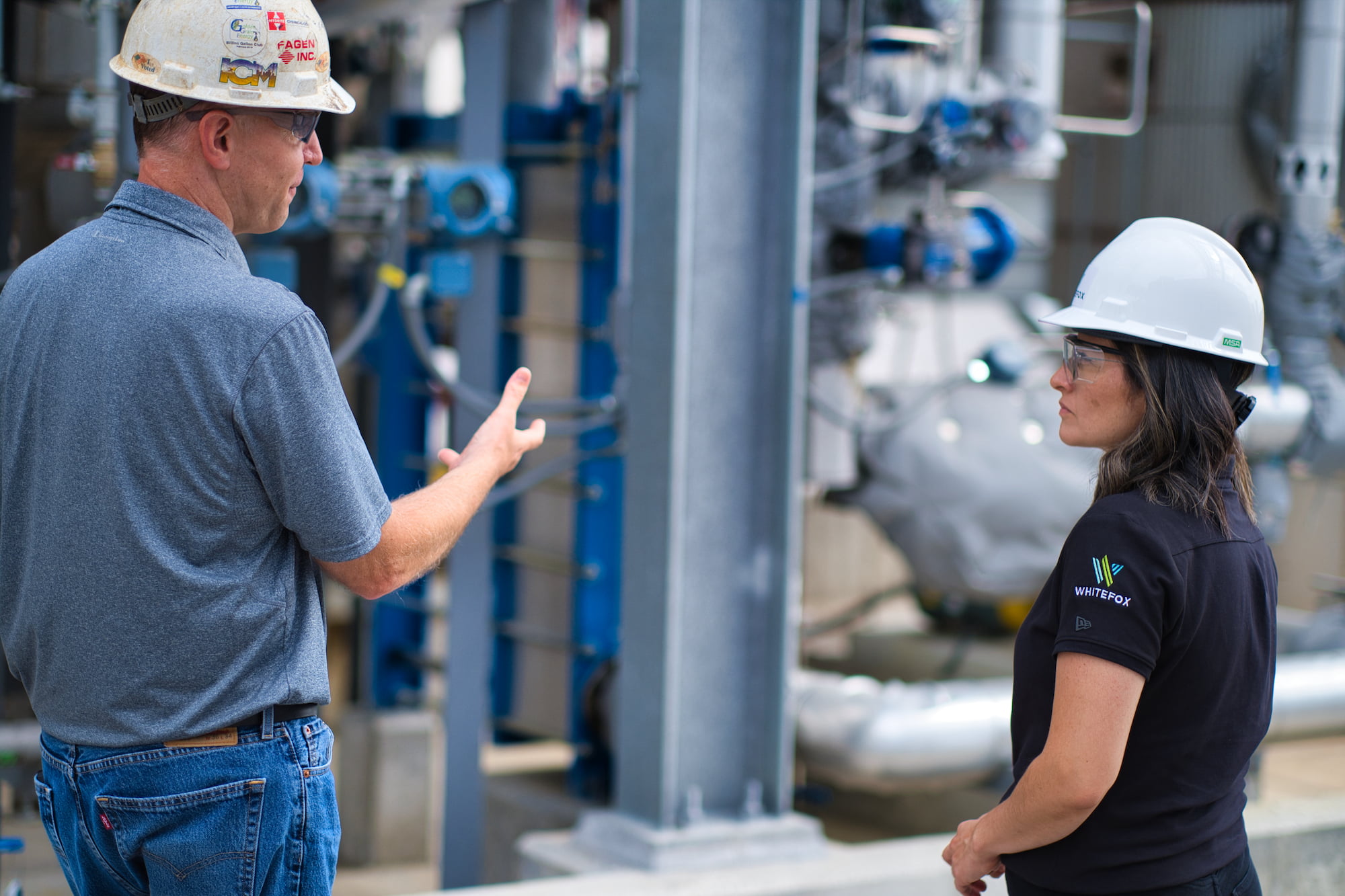 Whitefox's Product Engineering Manager, Jessica Lopez, at partners' Golden Grain Energy, LLC plant discussing Whitefox ICE® membrane dehydration unit.